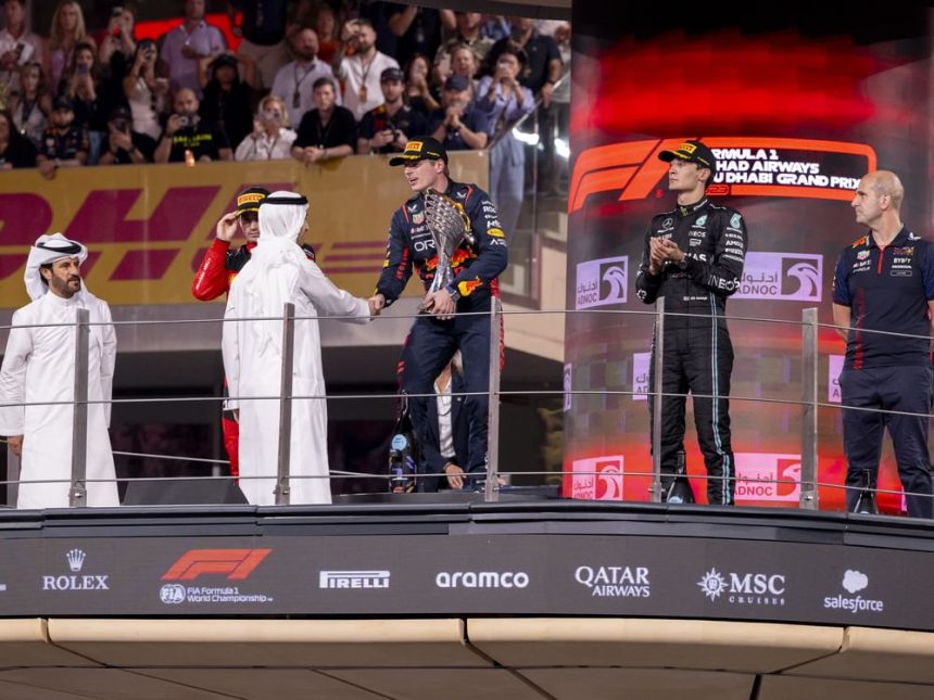 Hamdan bin Mohamed bin Zayed presents trophy to Formula 1 Etihad Airways Abu Dhabi Grand Prix 2023 winner Max Verstappen